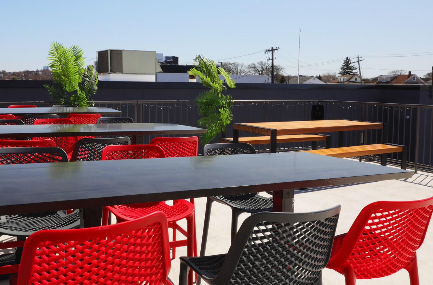 Open-air Deck seating with red and black chairs